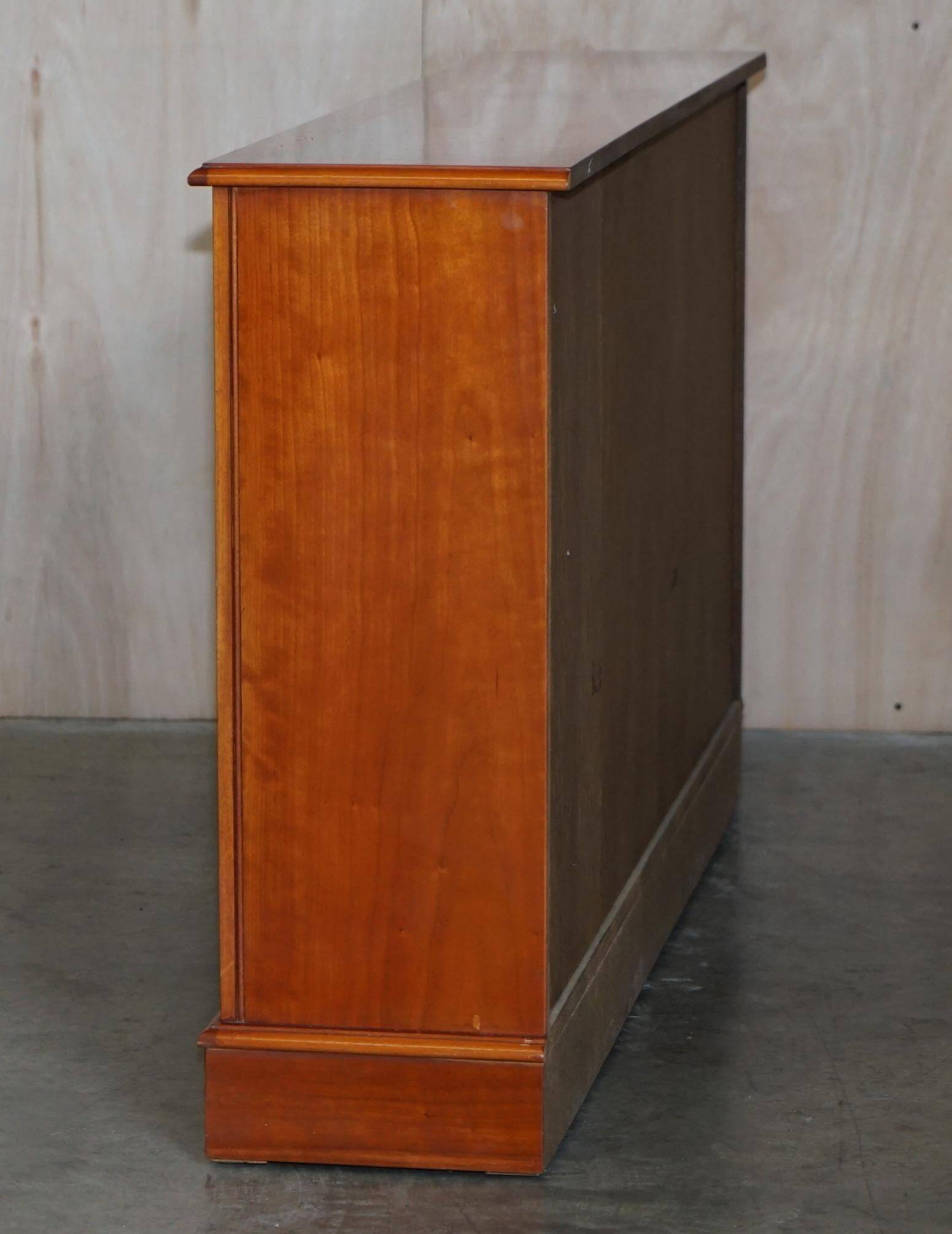 Vintage yew wood library/buffet with three drawers.