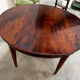 Extendable mahogany round table in Louis XVI style