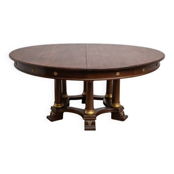 Grande table ronde à allonges–piètement à colonnes–époque Empire / acajou