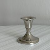Small shiny metal candle holder