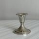 Small shiny metal candle holder