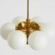 Suspension en laiton Kaiser Leuchten des années 1960 avec 6 abat-jours en verre opale.