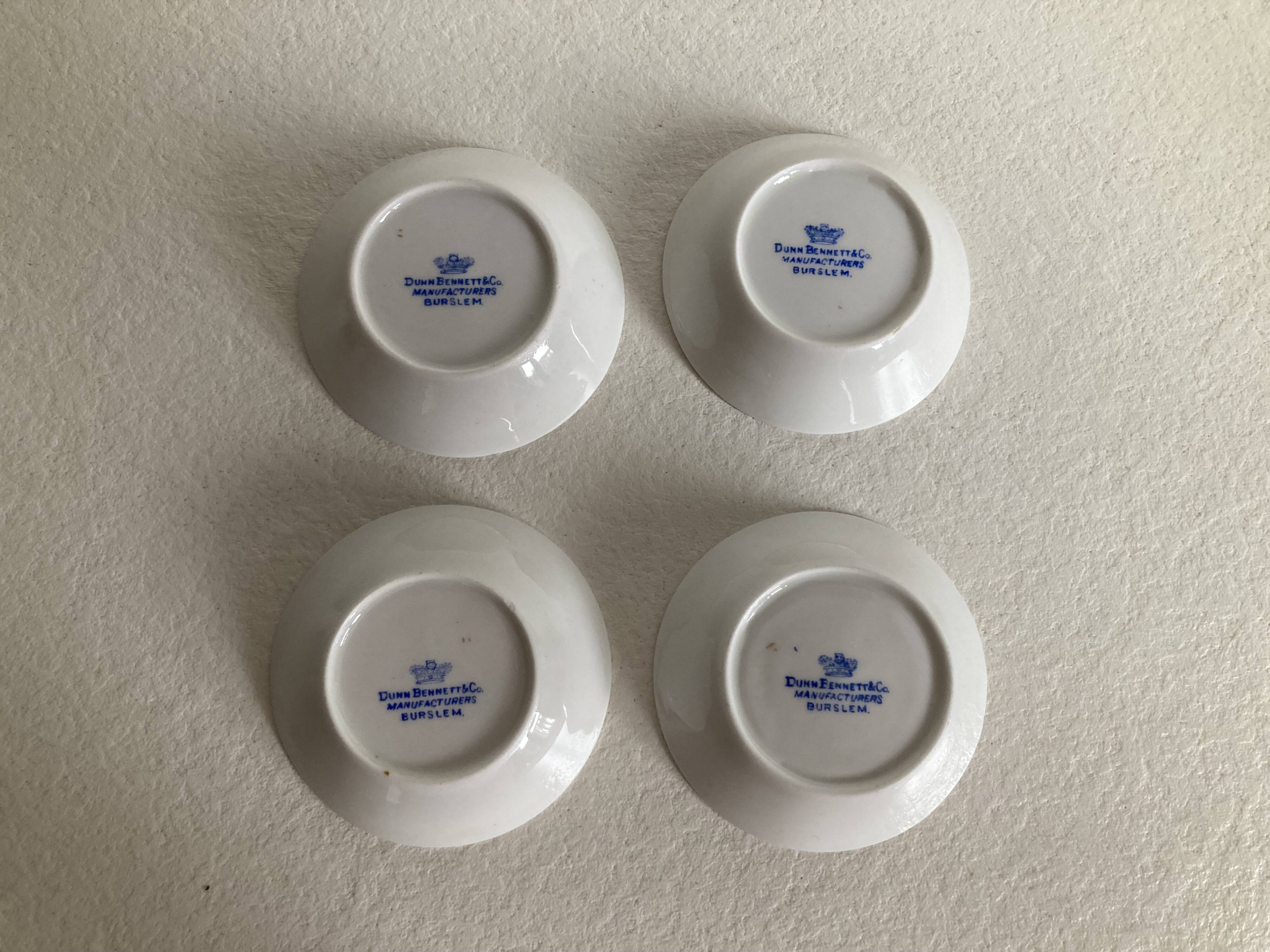 4 coffee cups and saucers