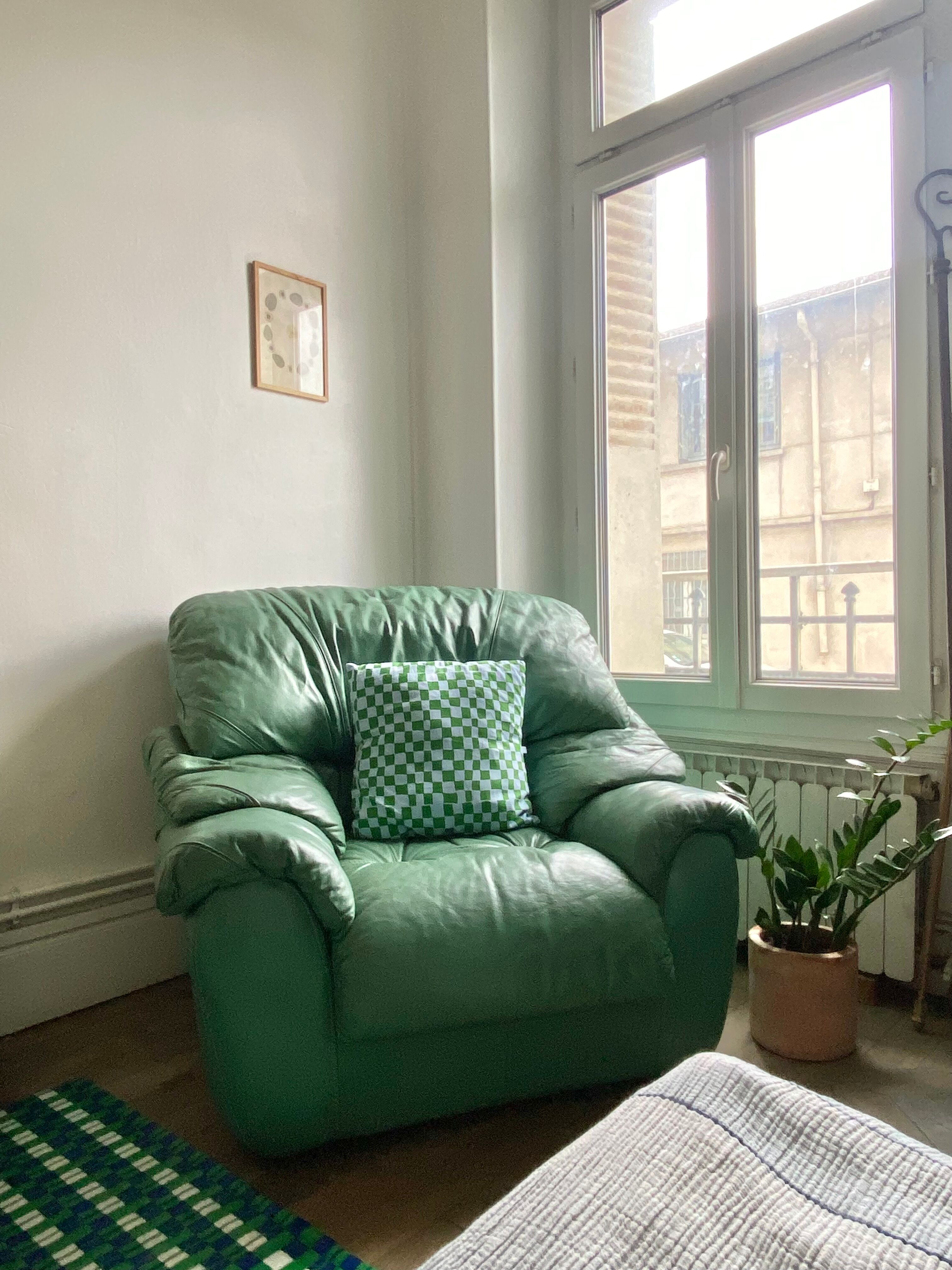 New armchair in vintage green leather