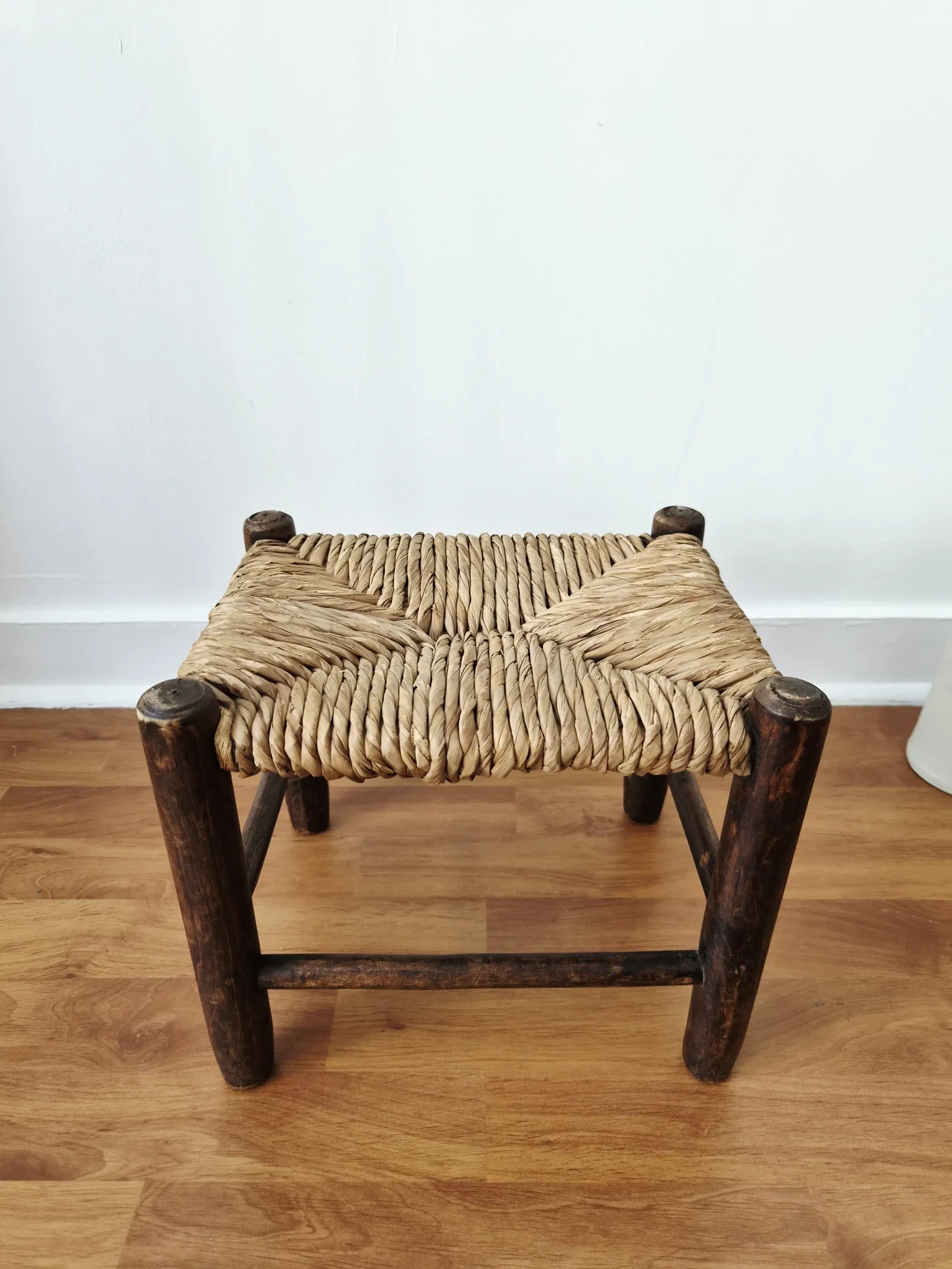 Small rustic vintage wooden and straw stool -