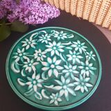 Dessous de plat vert à fleurs