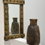 Brutalist mirror with a hammered copper and brass frame.