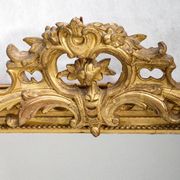 Louis-Philippe mirror from the 19th century with a ribbon trompe-l'œil frame.