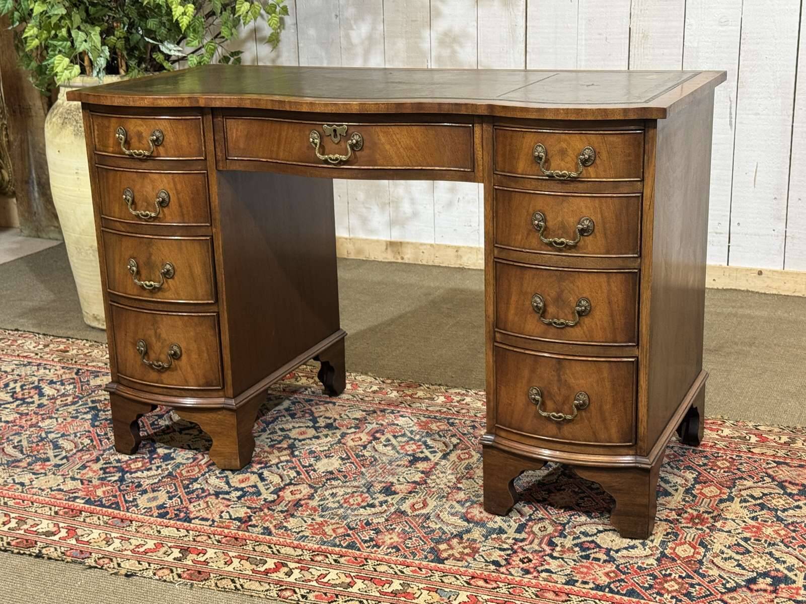 English desk from the 1950s in mahogany with a leather top.