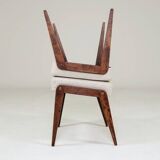 Pair of wooden stools with beige fabric.