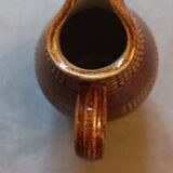 Shiny sandstone pitcher