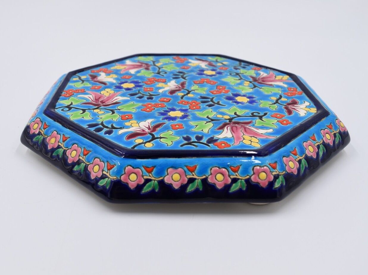 A flat bottom and two enamel bottle bottoms of Longwy