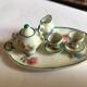 Small antique tea set in porcelain for children.