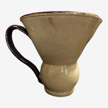 Folk art pitcher in glazed clay flared shape