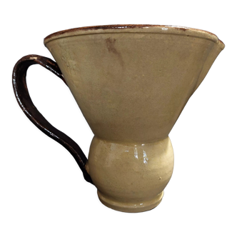 Folk art pitcher in glazed clay flared shape