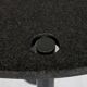 Round dining table in black lacquered metal with a granite top.