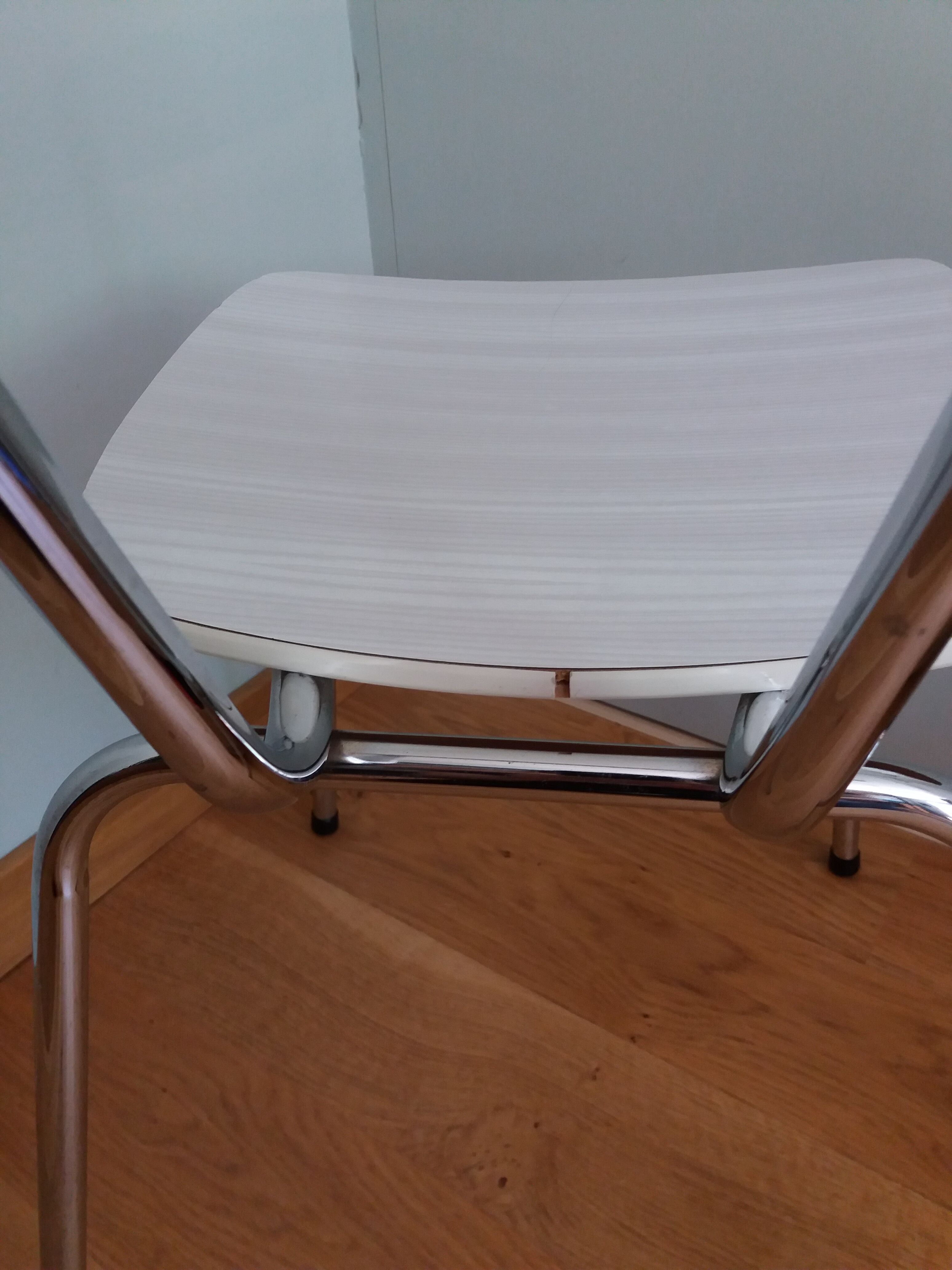 Chrome metal chair and formica white striped gray