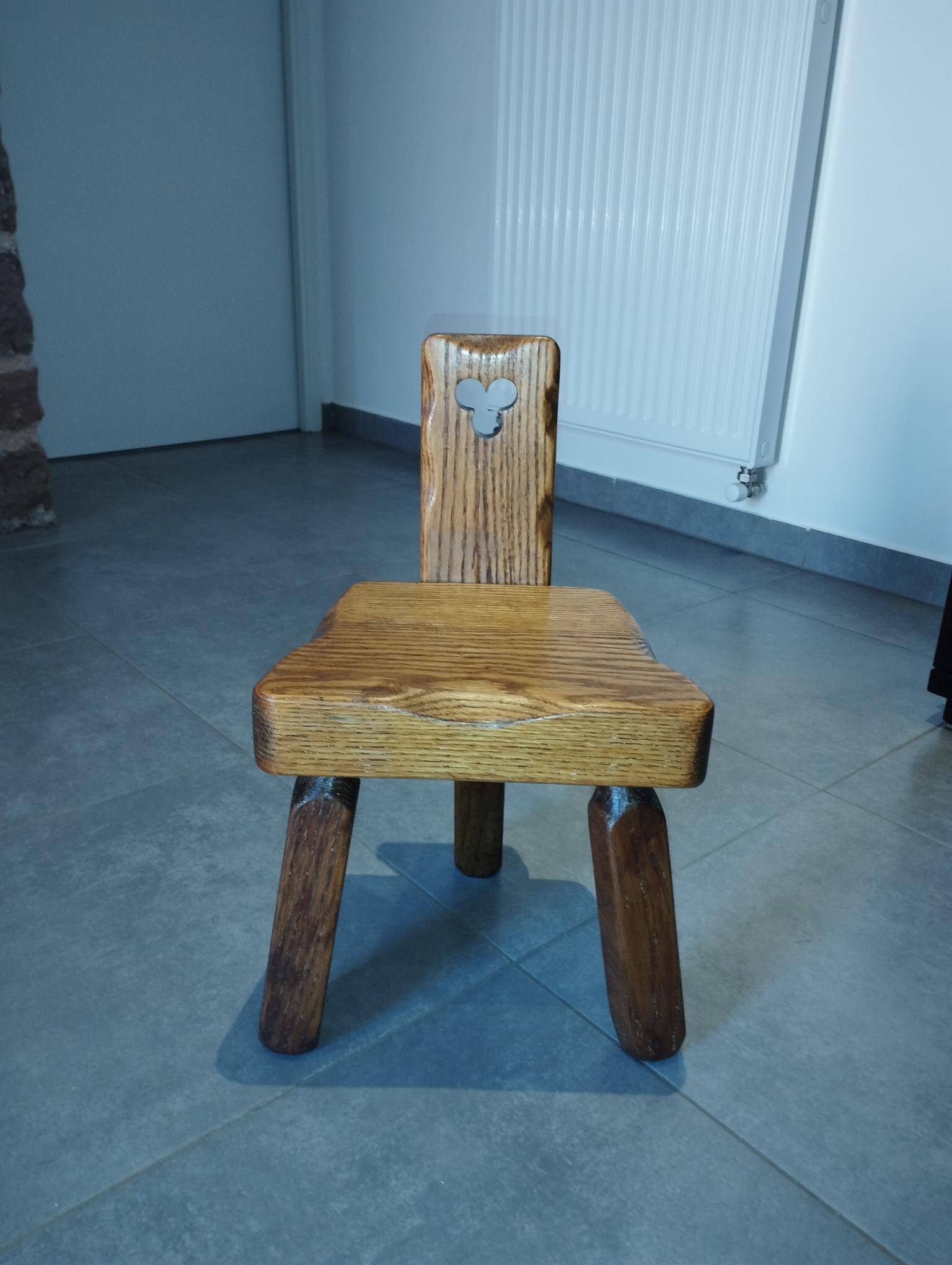 Tripod chair for children, Scandinavian brutalist chalet design.