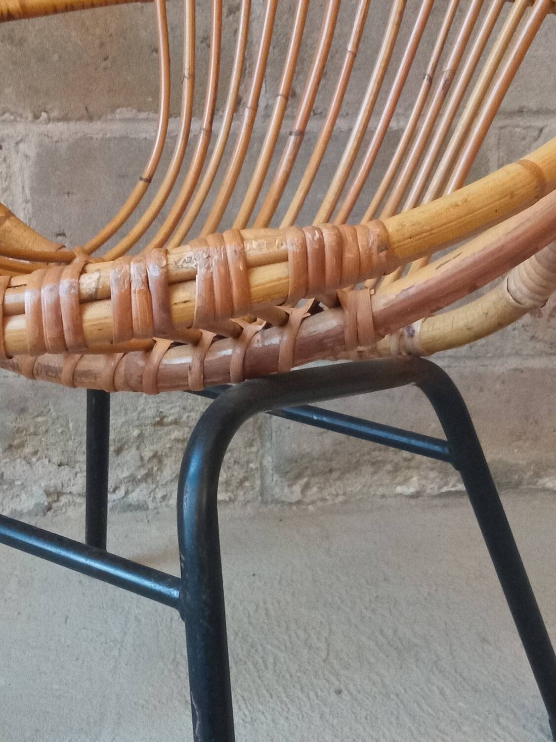 Rattan armchair with metal base from the 1950s