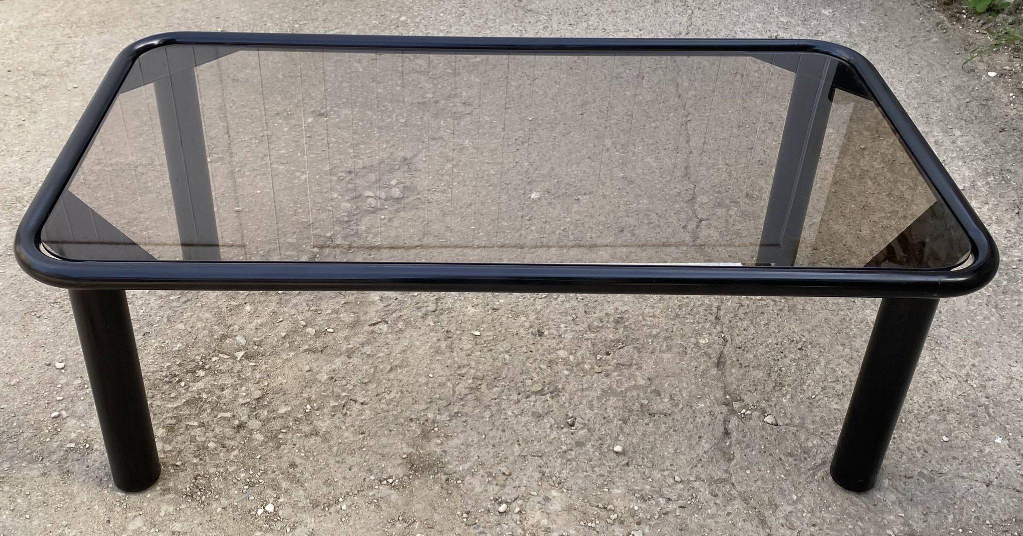 Vintage black tubular coffee table with smoked glass by Yves Boutboul, 1980.