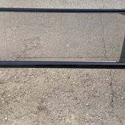 Vintage black tubular coffee table with smoked glass by Yves Boutboul, 1980.