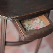 Wooden drawer table or 19th-century work table with a curved wooden stretcher, in the style of Thonet, circa 1900-1920.