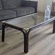 Bamboo coffee table with brass corners and smoked glass