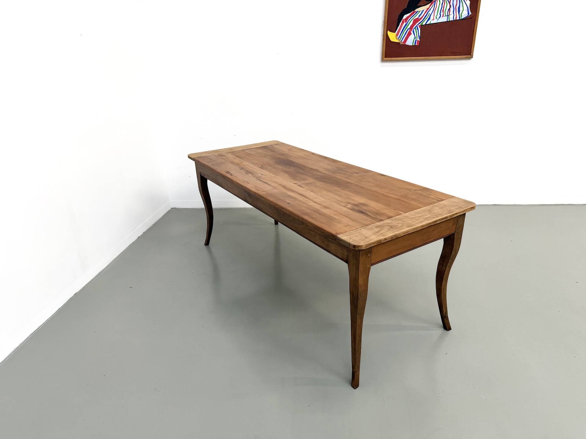 Farm table in solid cherry — Saber legs, Circa 1880