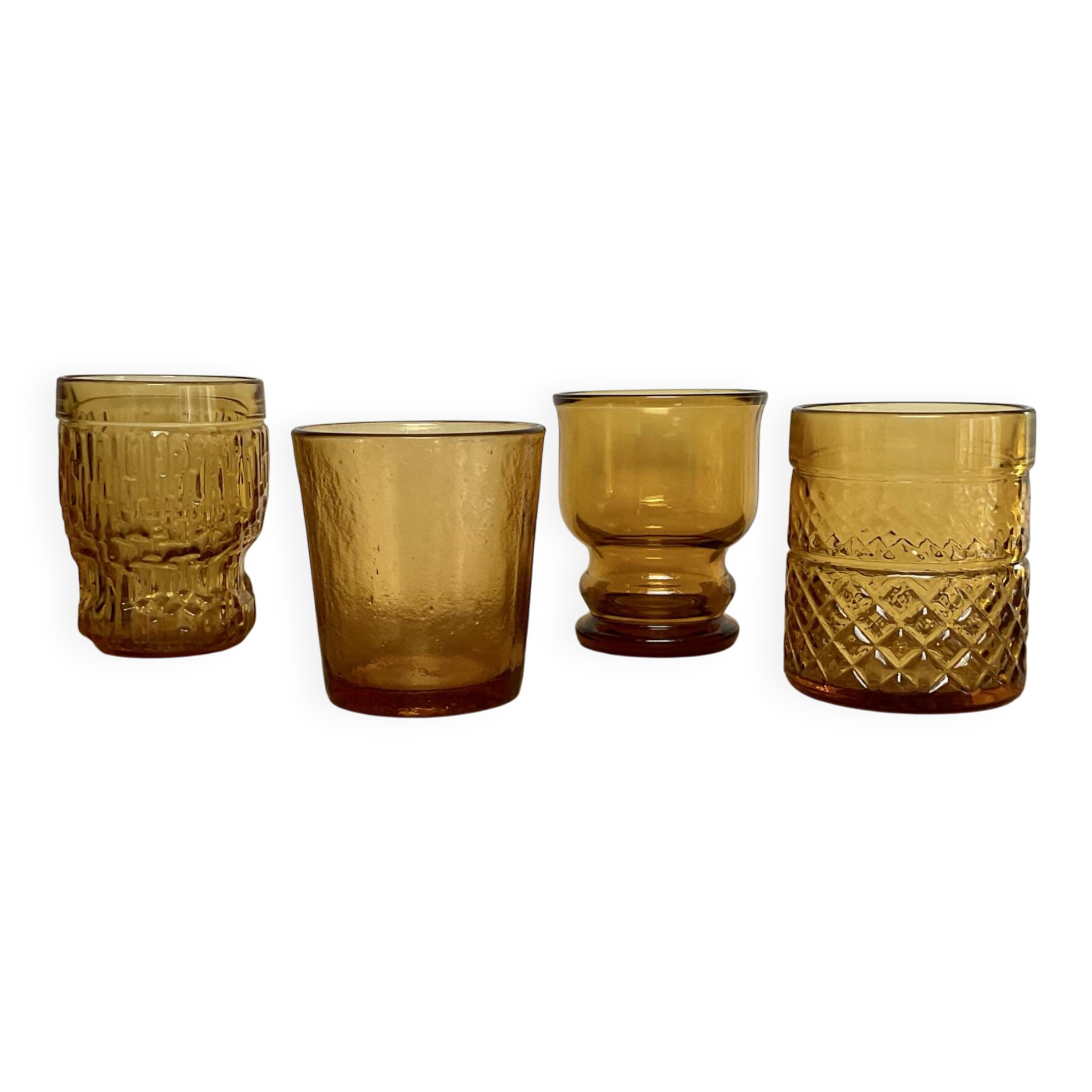 4 mismatched amber glasses