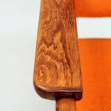 Vintage armchair in papaya orange wool from the 1960s.