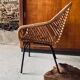 Rattan armchair and black metal base 1960