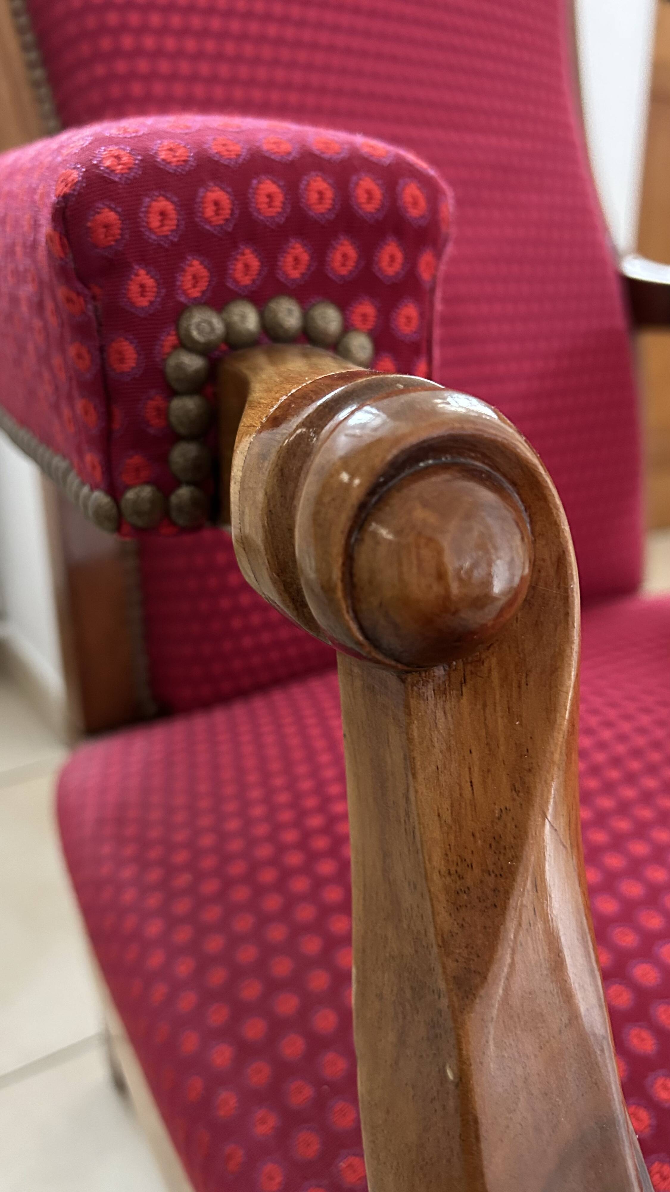 Antique Louis Philippe armchair in walnut and red fabric.