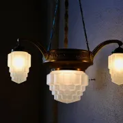 Art Deco lustre in brass and frosted pressed glass from the 1930s.
