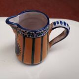 Small milk jug signed AR-H