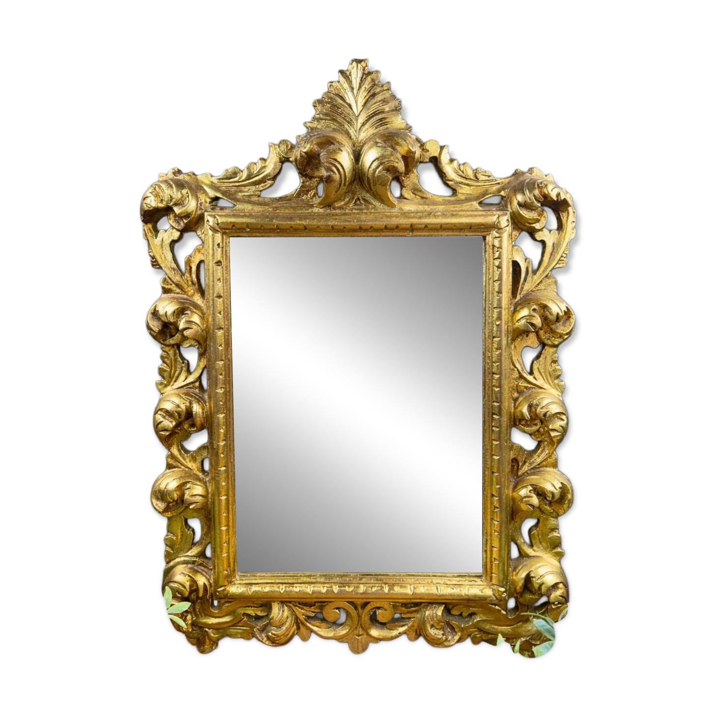 Antique Louis XV style mirror in gilded carved wood.