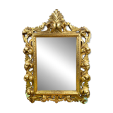 Antique Louis XV style mirror in gilded carved wood.