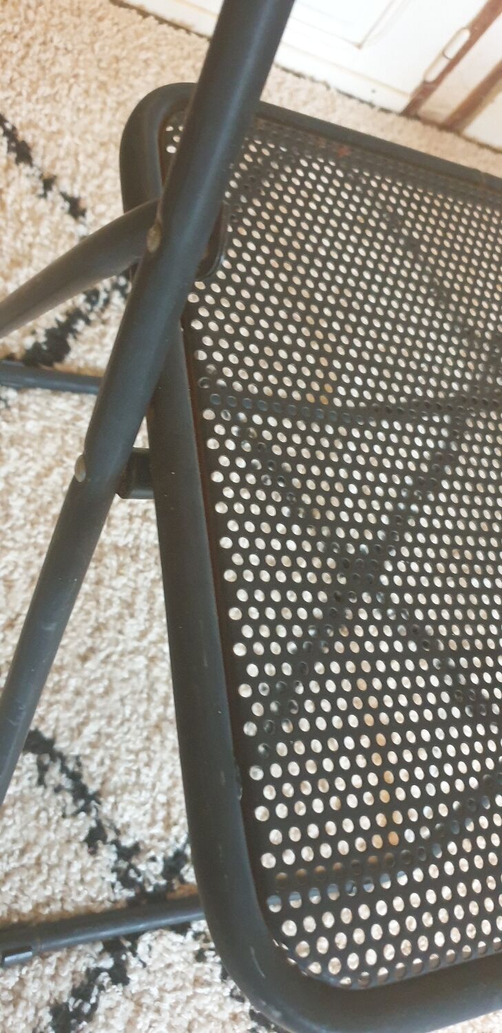 Pair of folding chairs in perforated metal