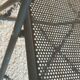 Pair of folding chairs in perforated metal