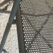 Pair of folding chairs in perforated metal