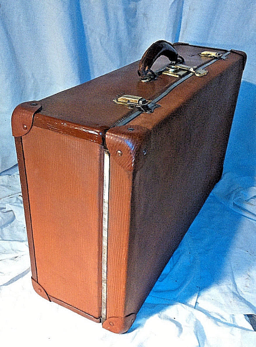 Old vintage black and white cardboard storage suitcase travel