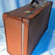 Old vintage black and white cardboard storage suitcase travel