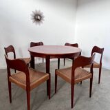 Round teak table with Scandinavian design extensions from the 60s vintage