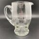 Glass jug with chiseled pattern