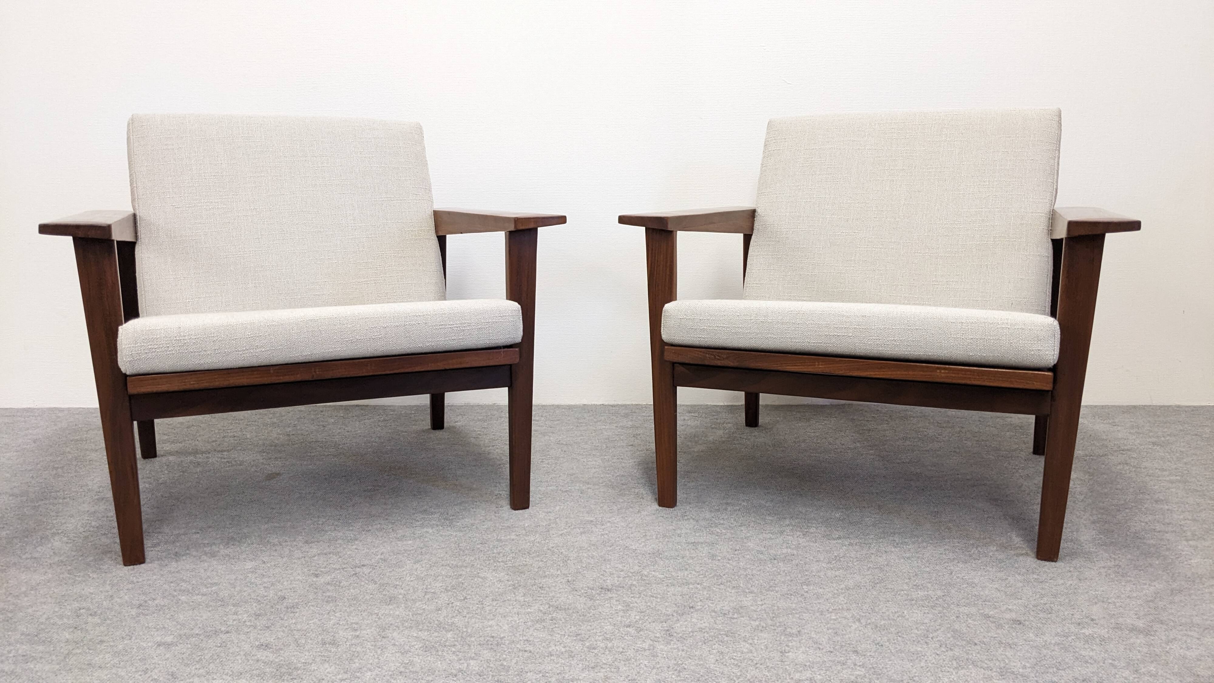 Pair of Scandinavian style armchairs in teak, France circa 1950.