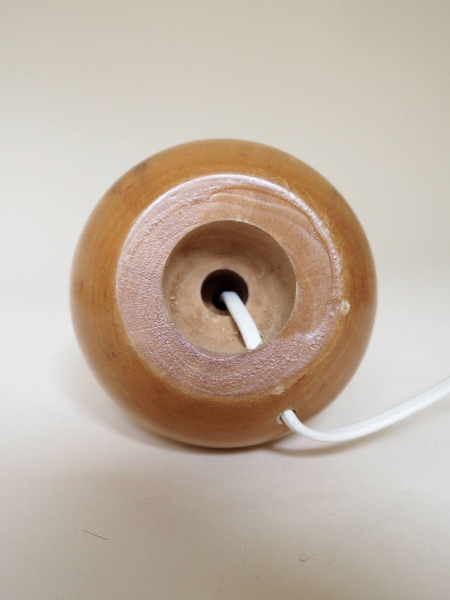 Turned wooden lamp with linen shade