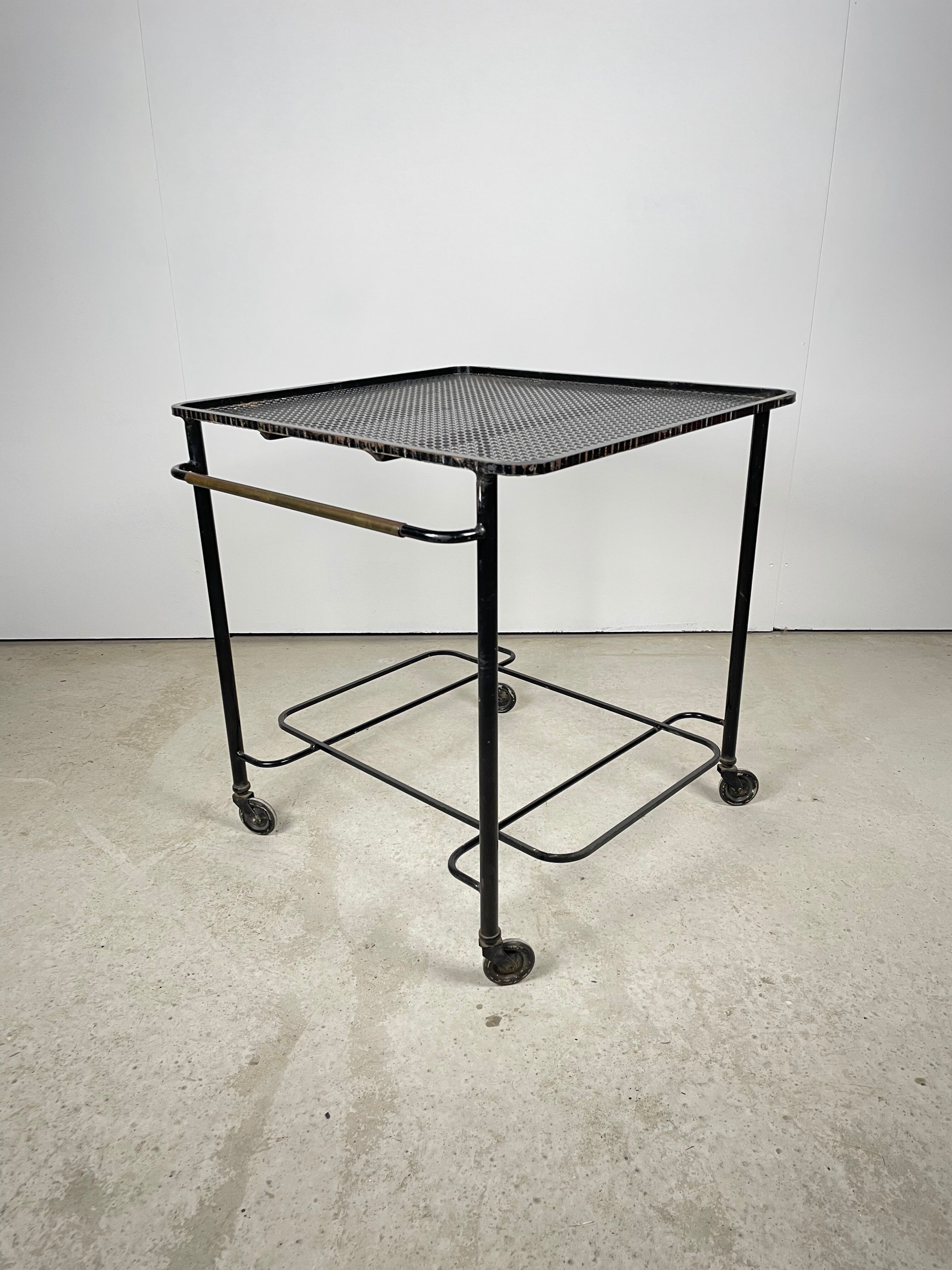 Trolley in perforated sheet metal