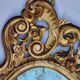 Large oval gold mirror, Louis XV rococo style, late 19th century, 114 x 66 cm.
