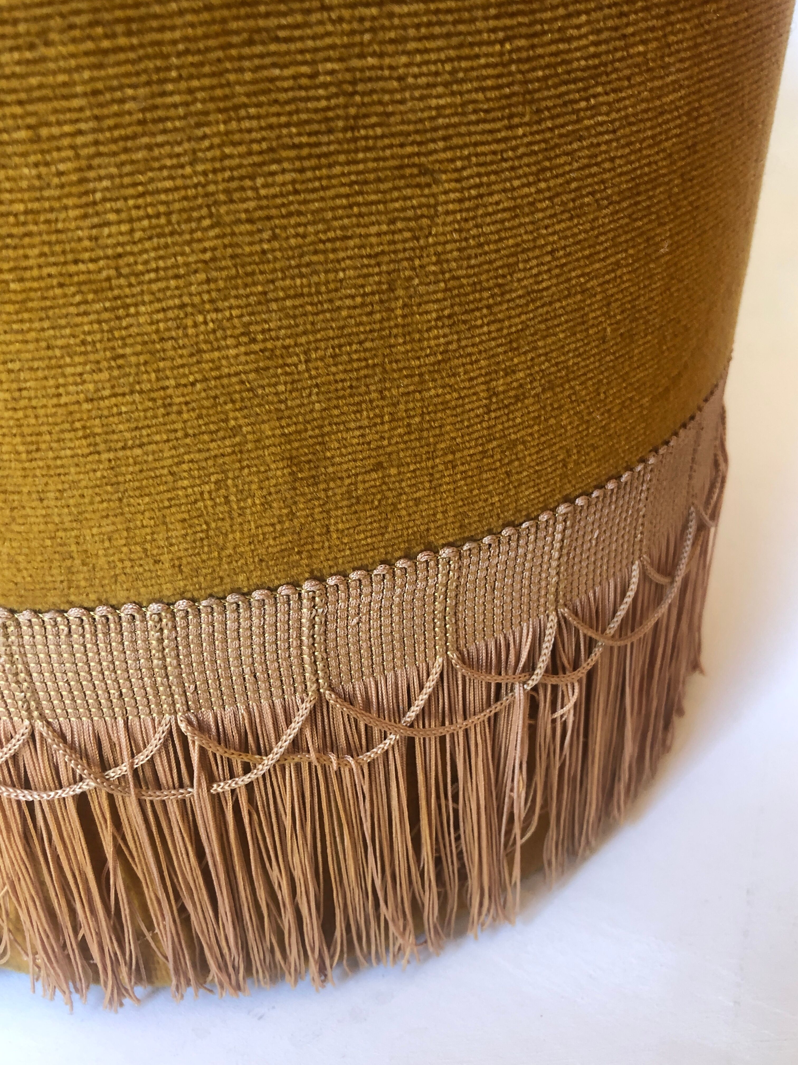 Velvet and fringed ottoman
