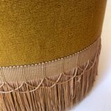 Velvet and fringed ottoman