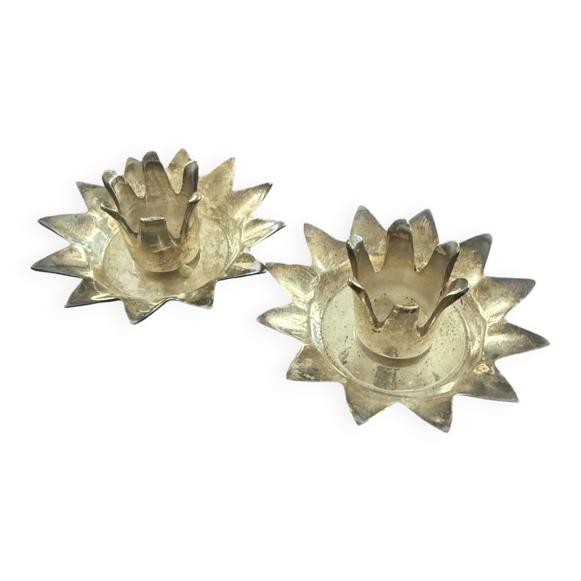 Pair of brass candle holders in the shape of a lotus flower.